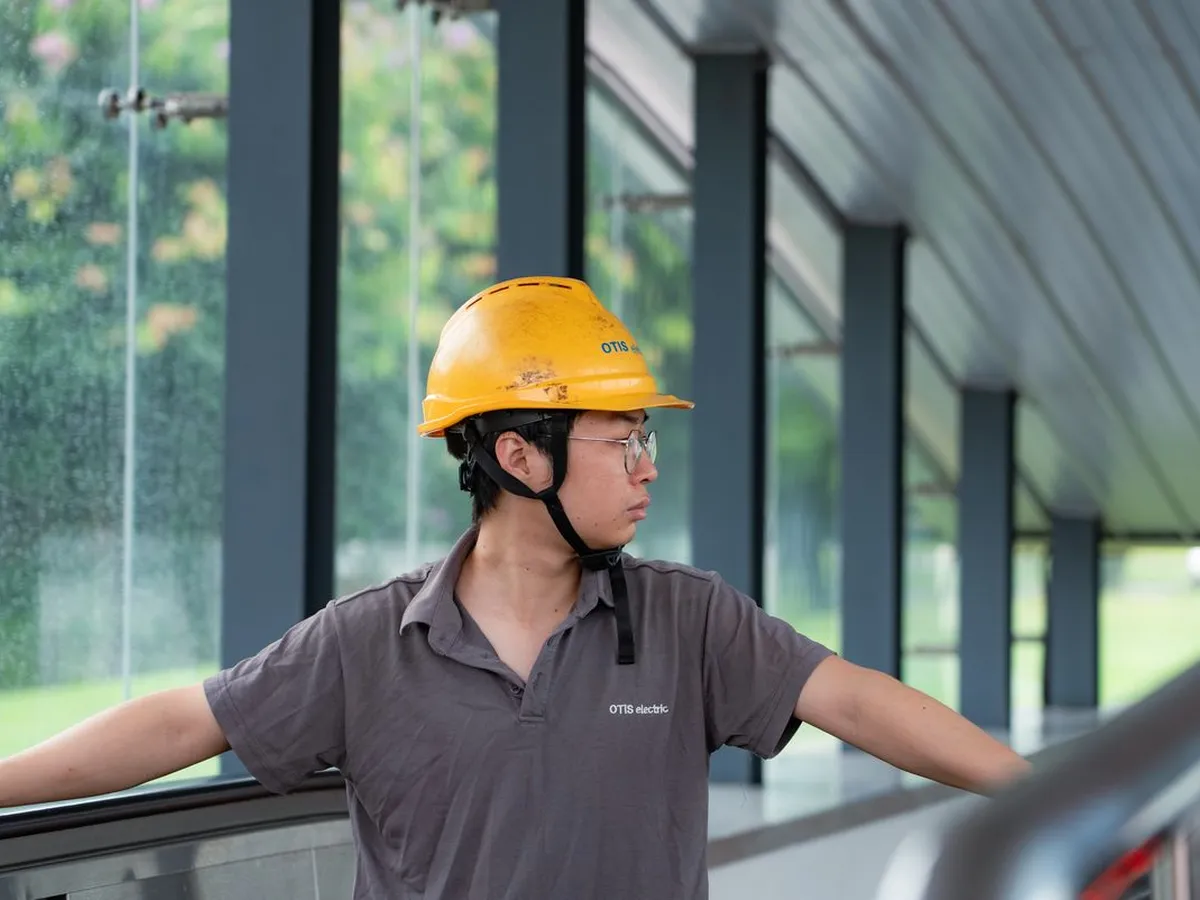 A hard-hatted worker inspecting a construction job site